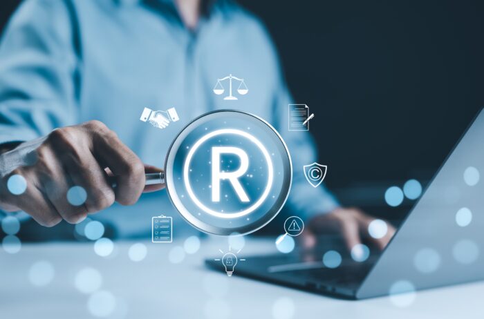 UKIPO to Scrap Trade Mark Series Applications: What It Means for Brand Owners 2 Registered,Trademark,,Intellectual,Property,Concept.,Businessman,Working,On,Laptop,With